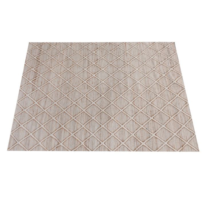 Chik handwoven wool and jute rug with a carved diamond lattice in ivory and natural, in a living room