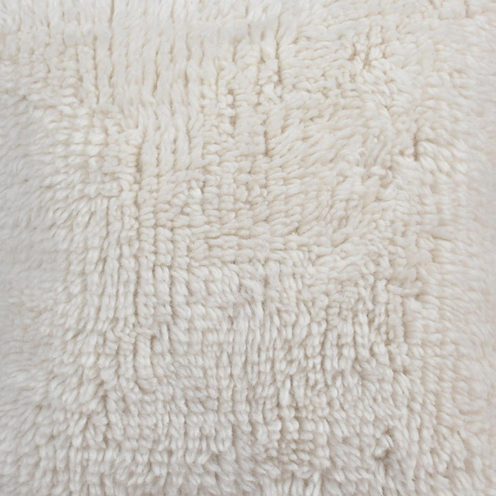 Snowmelt Handwoven New Zealand Wool Cushion — A deep ivory shag-style surface provides a soft-looking, tufted texture.