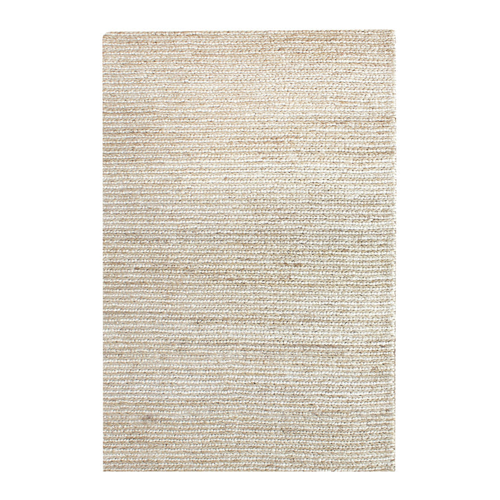 Kai handwoven hemp rug in natural with a sage cast and a tight chunky weave, in a living room