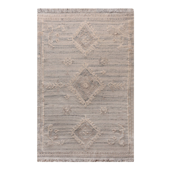 Canyon flatweave wool rug with ivory and taupe tribal diamonds, in a living room