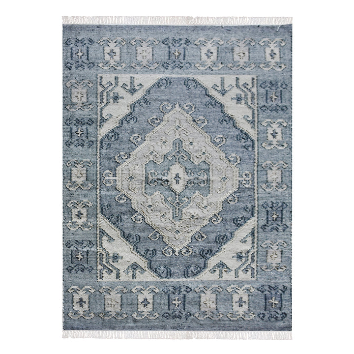 Courtyard flatweave slate blue recycled PET rug with an ivory Heriz medallion, on a patio