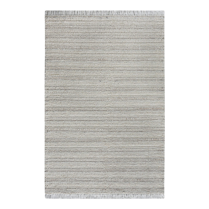 Kinara handwoven wool and jute rug in ivory and beige stripes, in a living room
