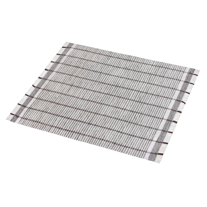 Awning handwoven denim and cotton rug with broad grey and ivory stripes, in a living room