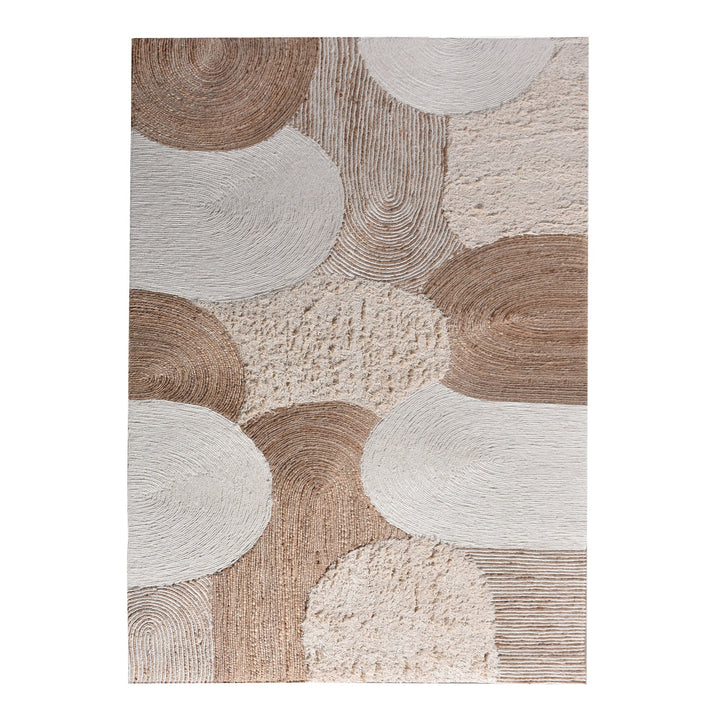 Boond handwoven wool, hemp and cotton rug with overlapping ivory and tan circles, in a bedroom