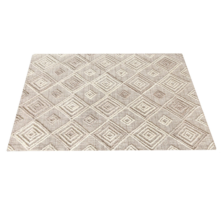 Jaali handwoven oatmeal wool rug with raised ivory diamond lattice, in a living room