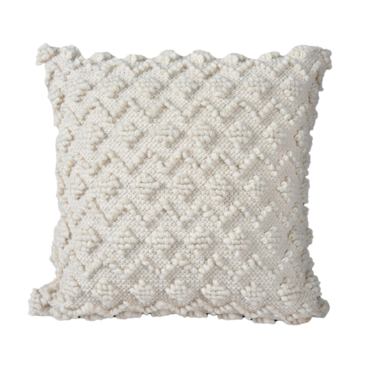 Loft Handwoven Wool & Cotton Cushion — Raised ivory diamonds create a full, sculpted surface.