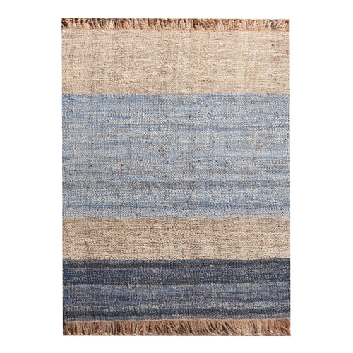 Nahar flatweave hemp and denim rug with a denim-blue stripe on natural hemp, in a living room