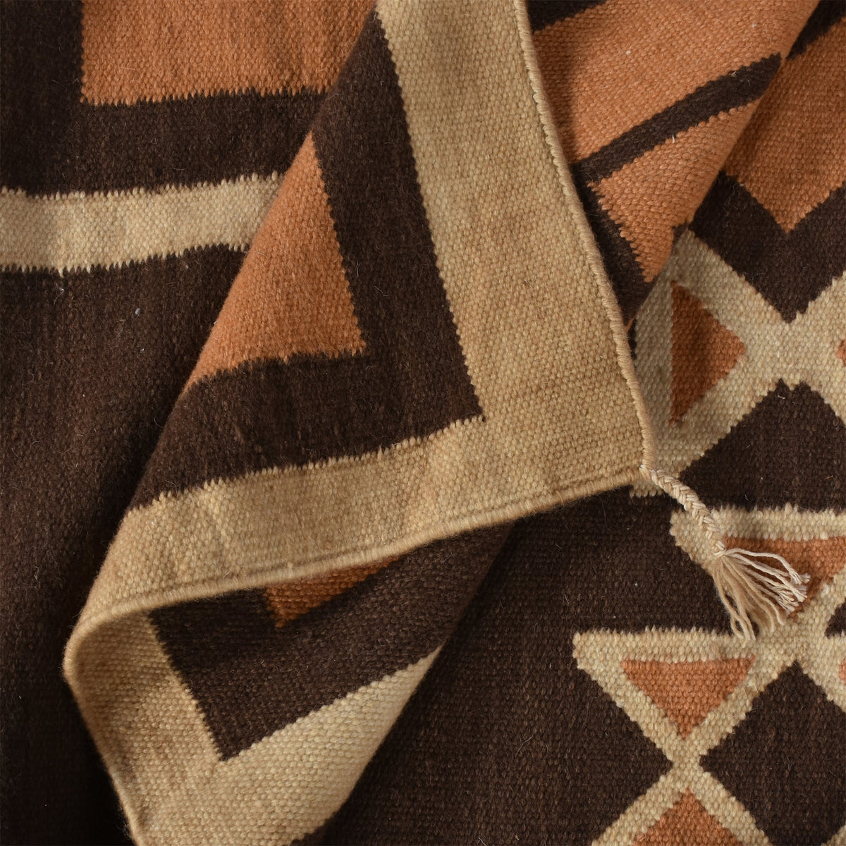 Ember flatweave New Zealand wool rug with rust and cream Southwestern diamonds, in an entryway