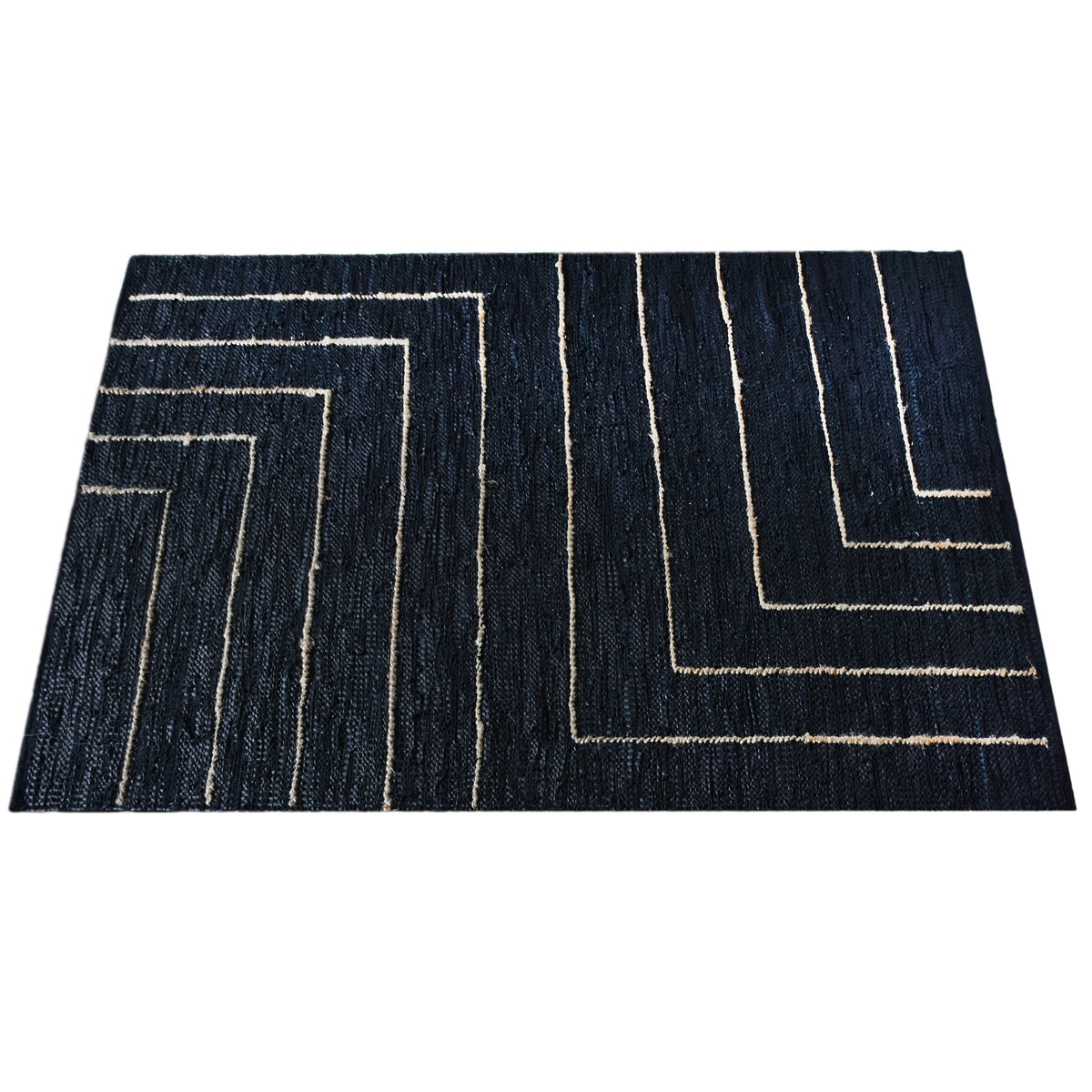 Aasmaan handwoven hemp and leather rug with cream nested angles on midnight navy, in a study