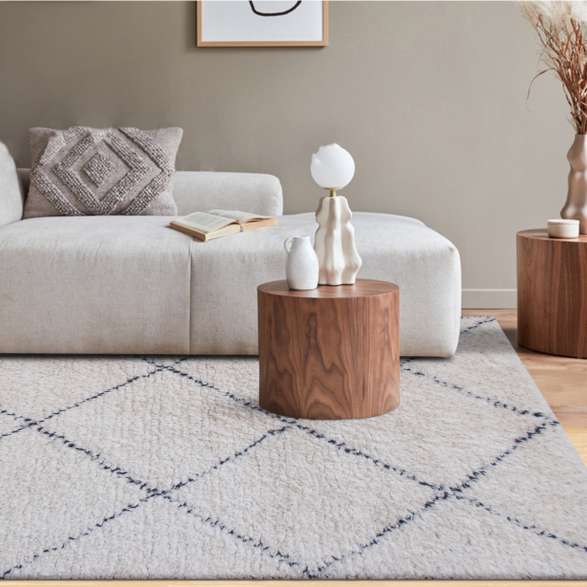 Snowfield handwoven wool rug with fine charcoal diamond lattice on ivory, in a study