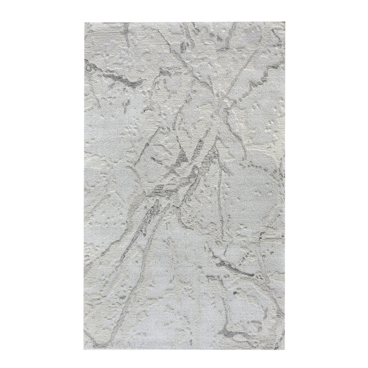 Daali handwoven wool and viscose rug with grey carved branch lines on ivory, in a bedroom