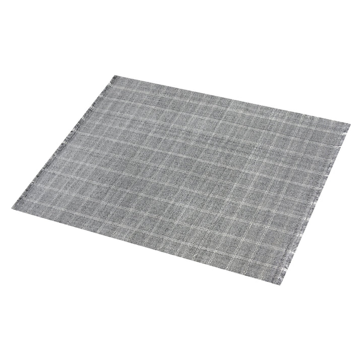 Pavilion handwoven slate grey and ivory recycled PET rug with a window-pane check, on a patio