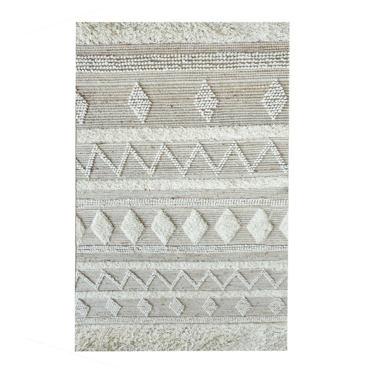Barley handwoven hemp and wool rug with raised ivory diamonds on cream, in a living room