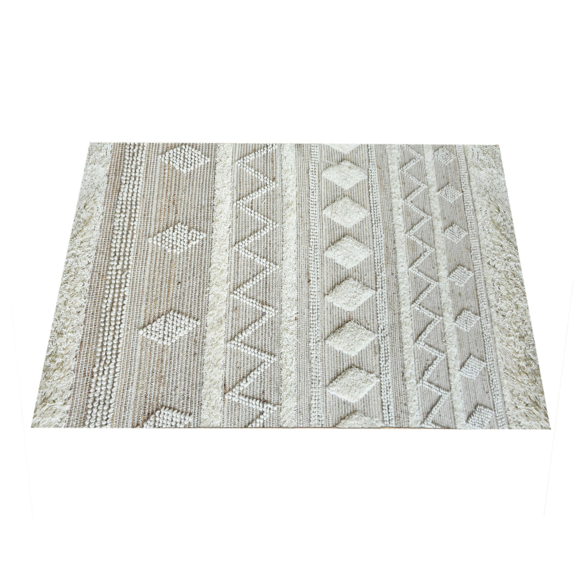 Barley handwoven hemp and wool rug with raised ivory diamonds on cream, in a living room