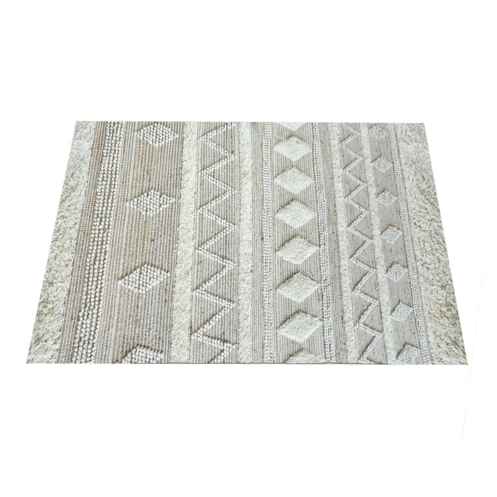 Barley handwoven hemp and wool rug with raised ivory diamonds on cream, in a living room