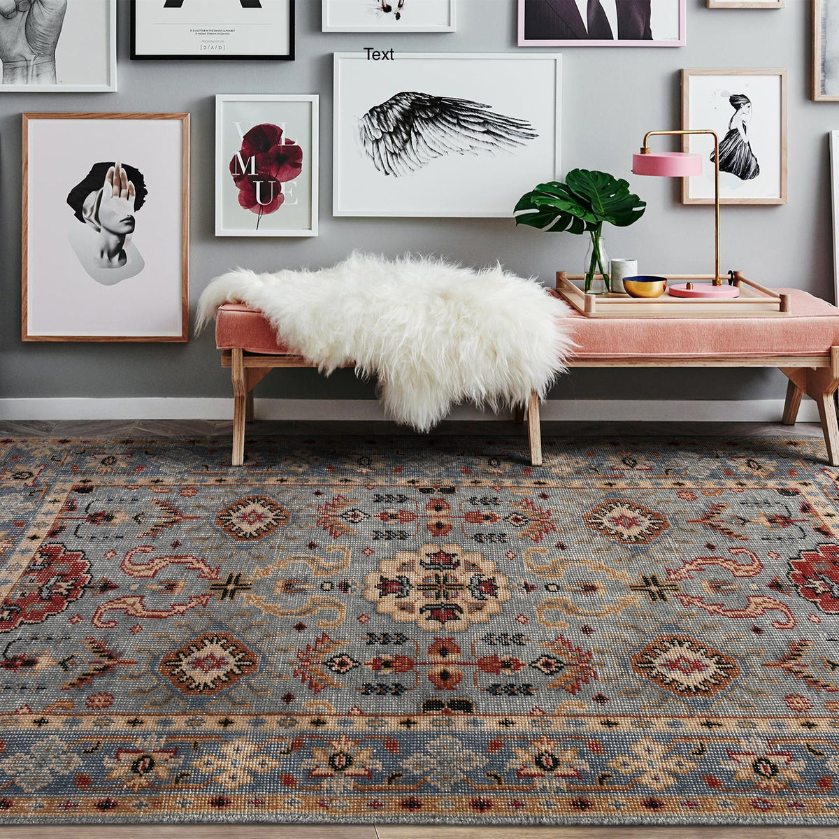 Manor hand-knotted slate grey wool rug with rust and red medallions, in a dining room