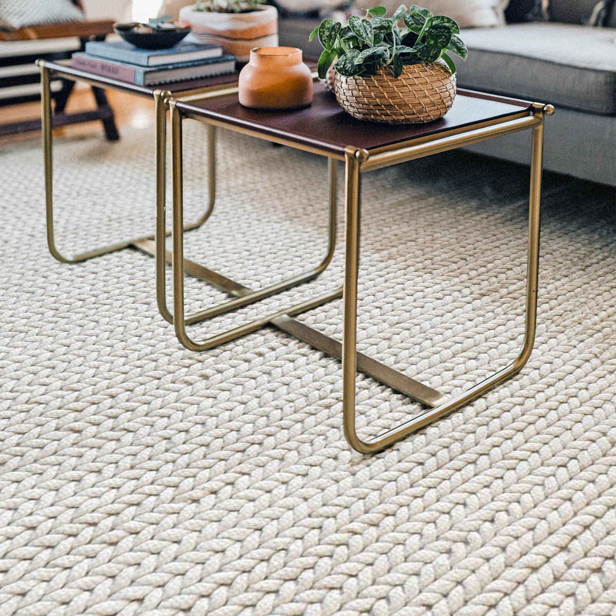 Dor handwoven chunky wool rug in charcoal, woven in thick cords, in a living room