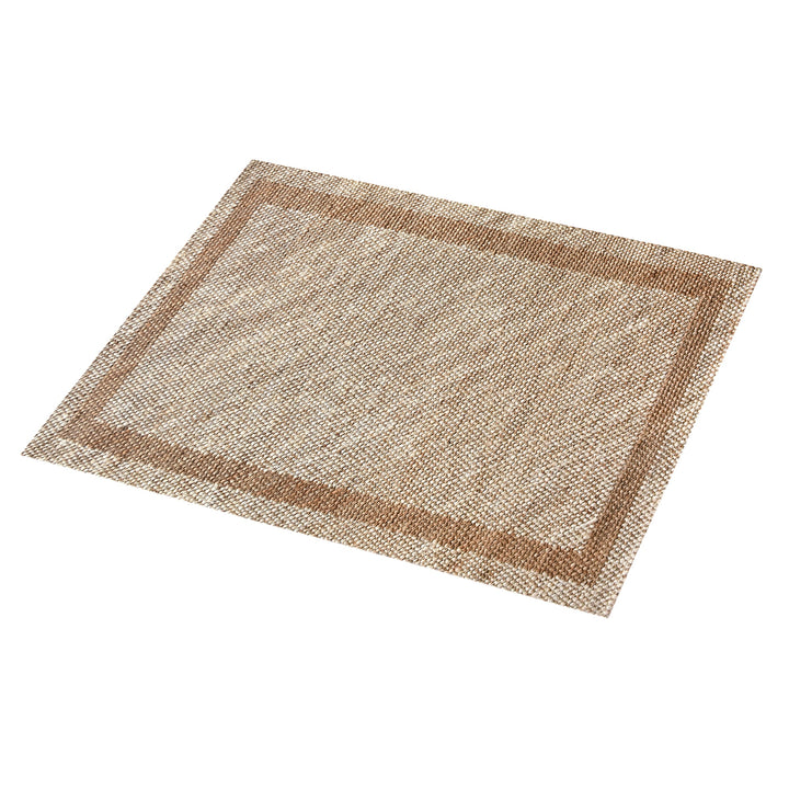 Chaukhat handwoven flatweave jute and wool rug in jute tan with a rust-brown border, in a living room