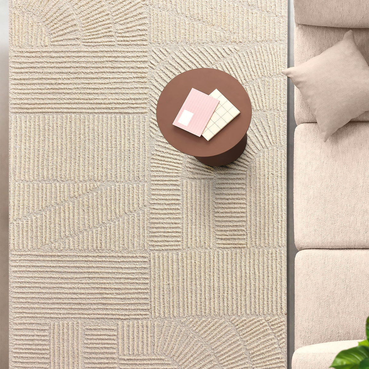 Kona handwoven cream wool rug with fine carved linear geometry, in a bedroom