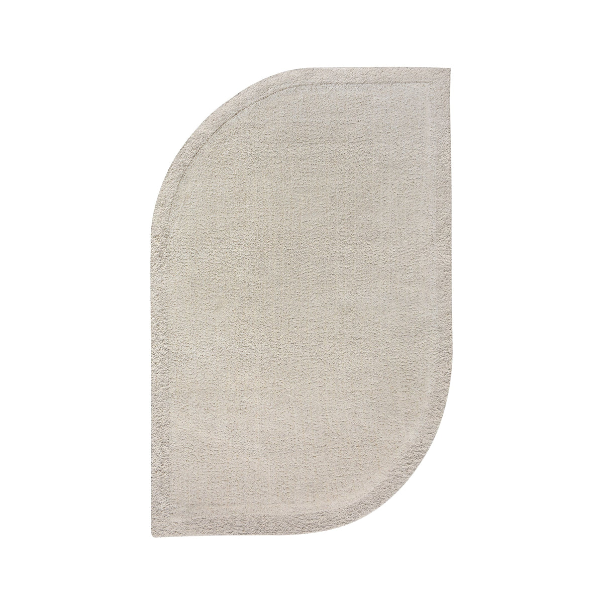 Gol handwoven wool rug in plain cream with a soft cut pile and a curved edge, in a nursery