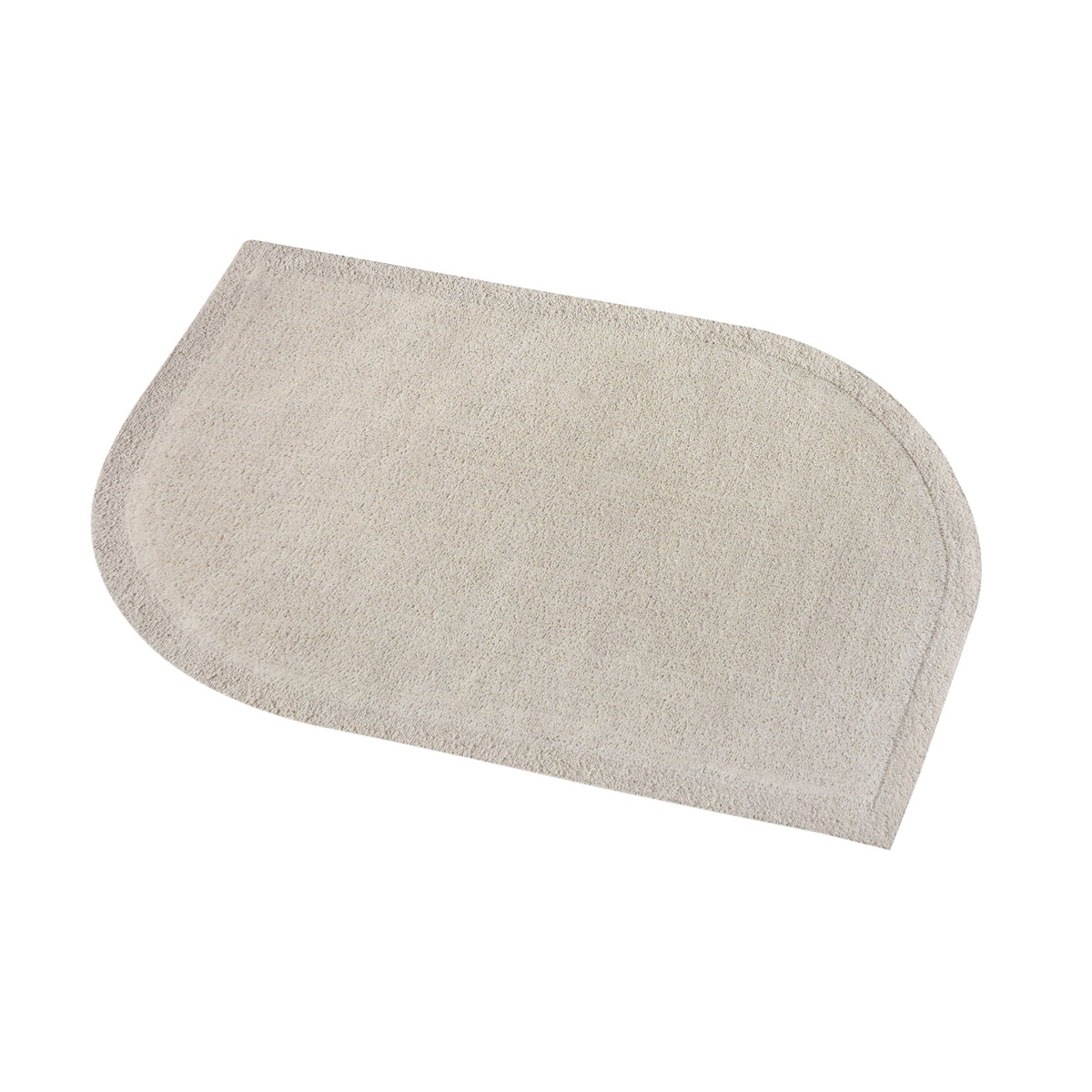 Gol handwoven wool rug in plain cream with a soft cut pile and a curved edge, in a nursery