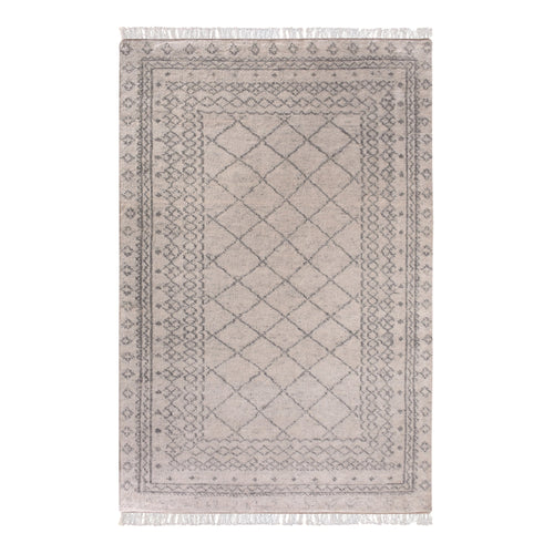 Phatak hand-knotted wool rug with an ivory diamond lattice and grey border, in a dining room