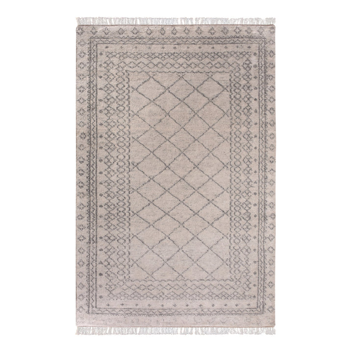 Phatak hand-knotted wool rug with an ivory diamond lattice and grey border, in a dining room