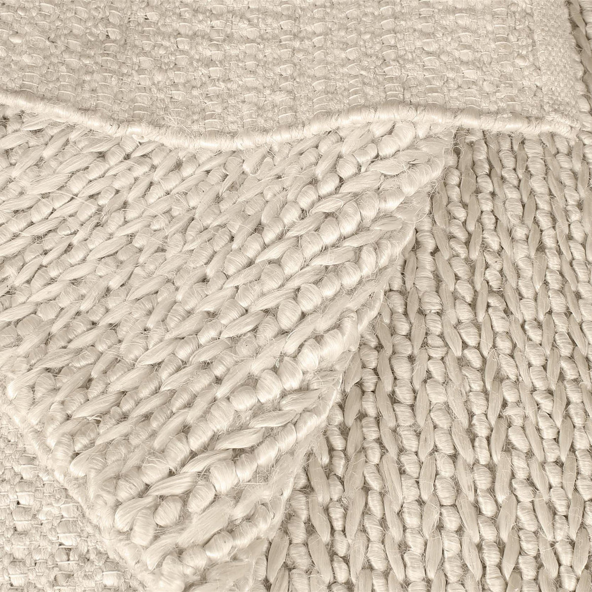 Kai handwoven hemp rug in natural with a sage cast and a tight chunky weave, in a living room