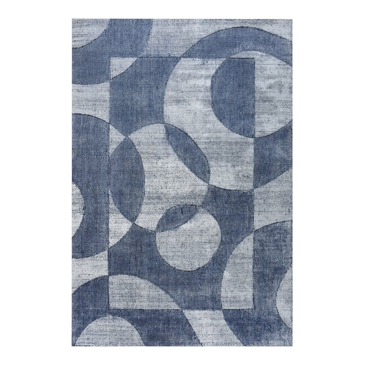 Mauj handwoven viscose and PET rug with denim blue overlapping circles on grey, in a living room