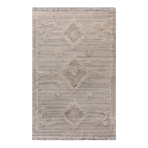 Canyon flatweave wool rug with ivory and taupe tribal diamonds, in a living room