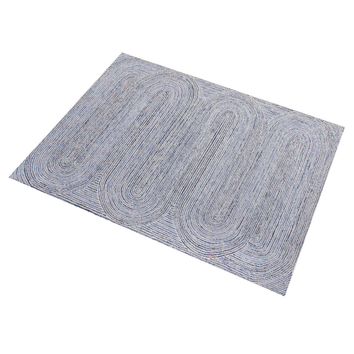 Estuary handwoven wool and denim rug with denim blue contour lines on ivory, in a dining room