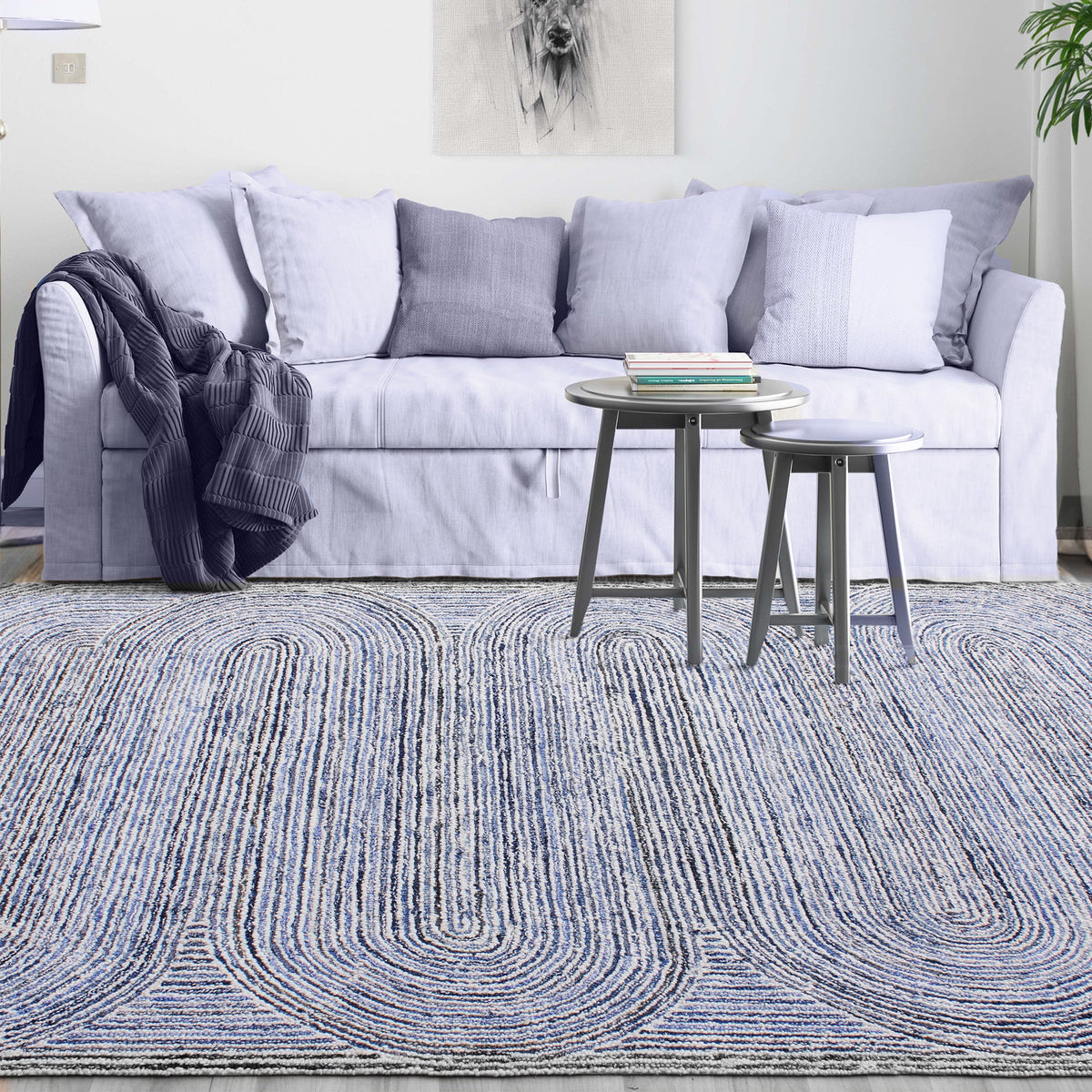 Estuary handwoven wool and denim rug with denim blue contour lines on ivory, in a dining room
