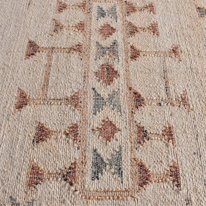 Lok handwoven wool and jute kilim flatweave rug with rust tribal motifs on a natural ground