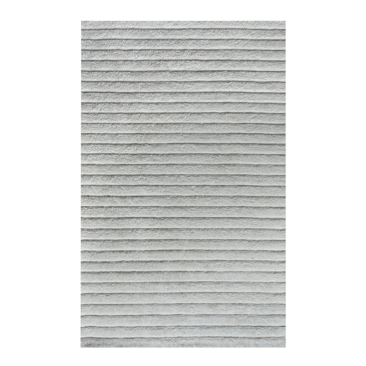 Sopan handwoven New Zealand wool rug with broad ivory ridges, in a living room