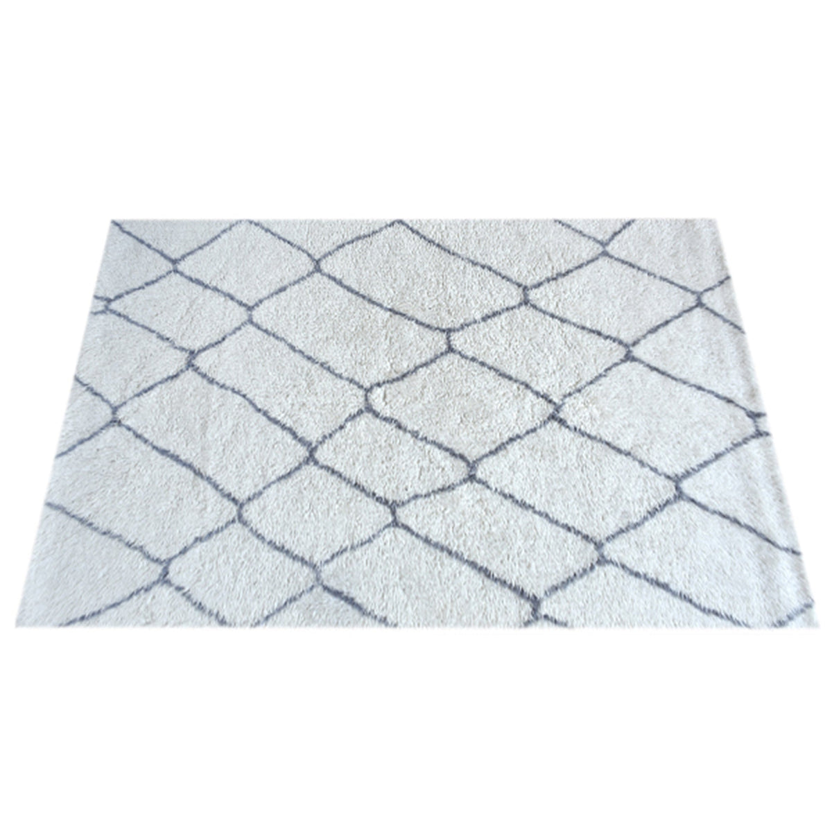 Kohra tufted New Zealand wool rug with a grey diamond lattice on white, in a living room