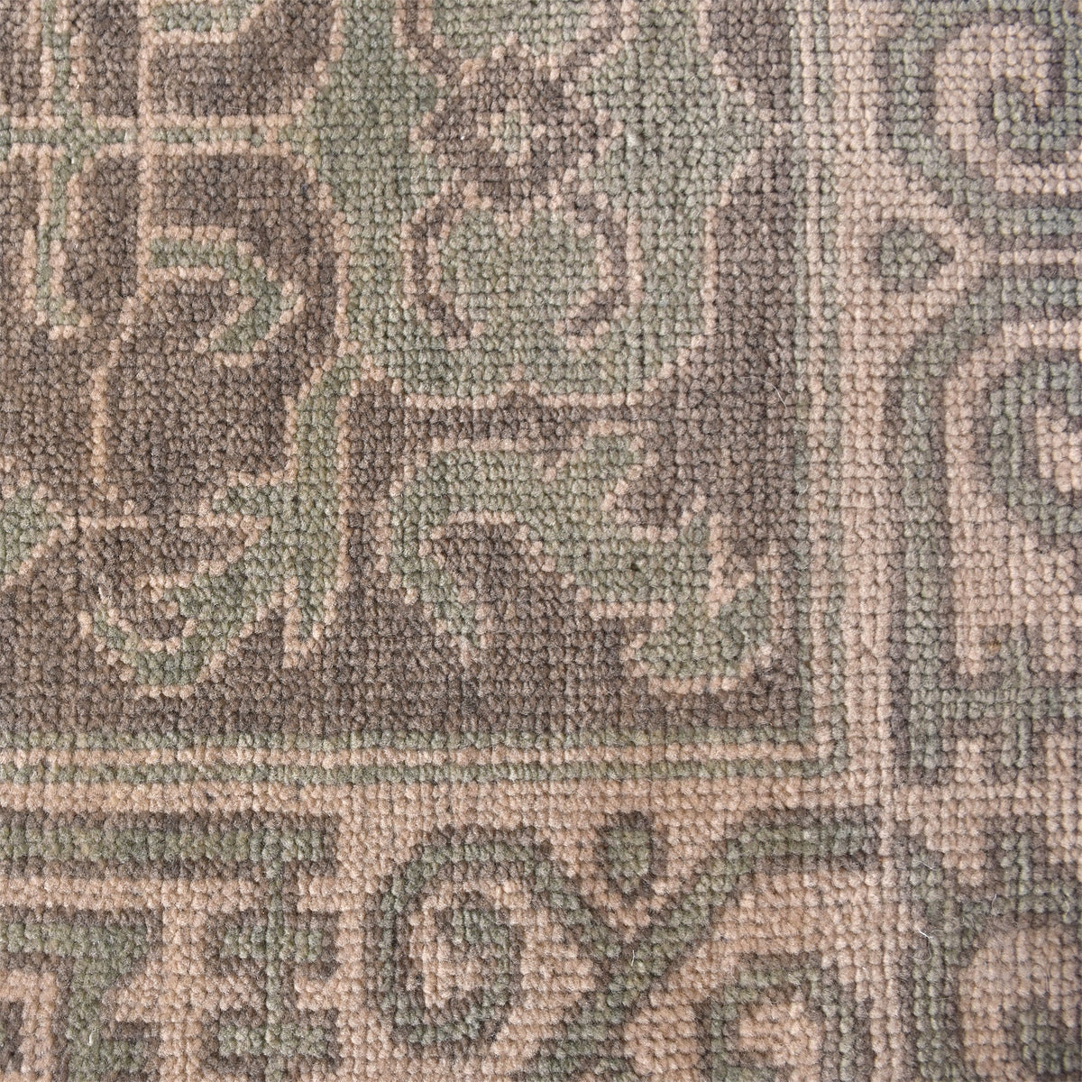 Teacup hand-knotted wool rug with dusty rose Aubusson florals on ivory, in a bedroom