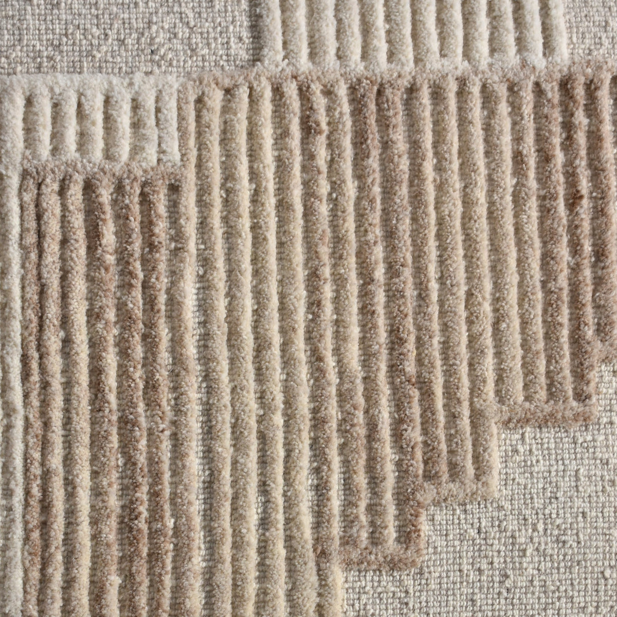 Fluted Textured Wool Wall Art — Raised linear rows form an architectural pattern in ivory and beige.