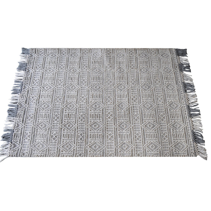 Baoli handwoven recycled PET rug with chunky ivory and grey tribal geometry, in an entryway