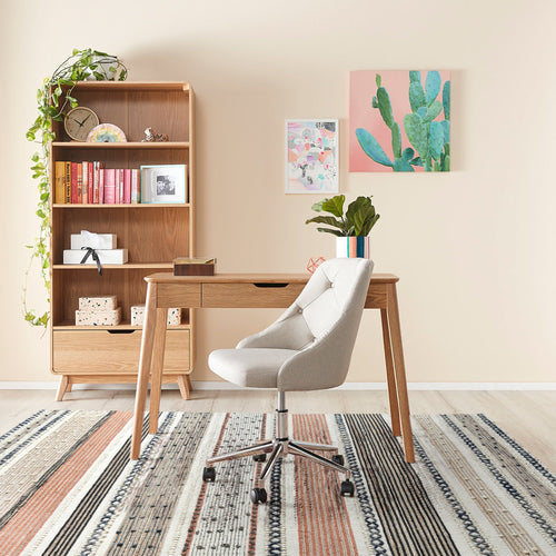 Bunting handwoven hemp and wool rug with horizontal rust, charcoal and ivory stripes, in a study
