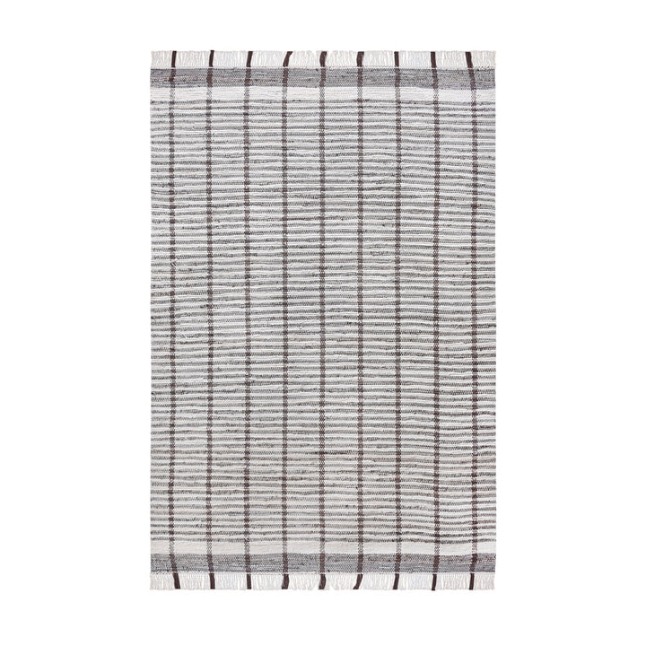 Awning handwoven denim and cotton rug with broad grey and ivory stripes, in a living room
