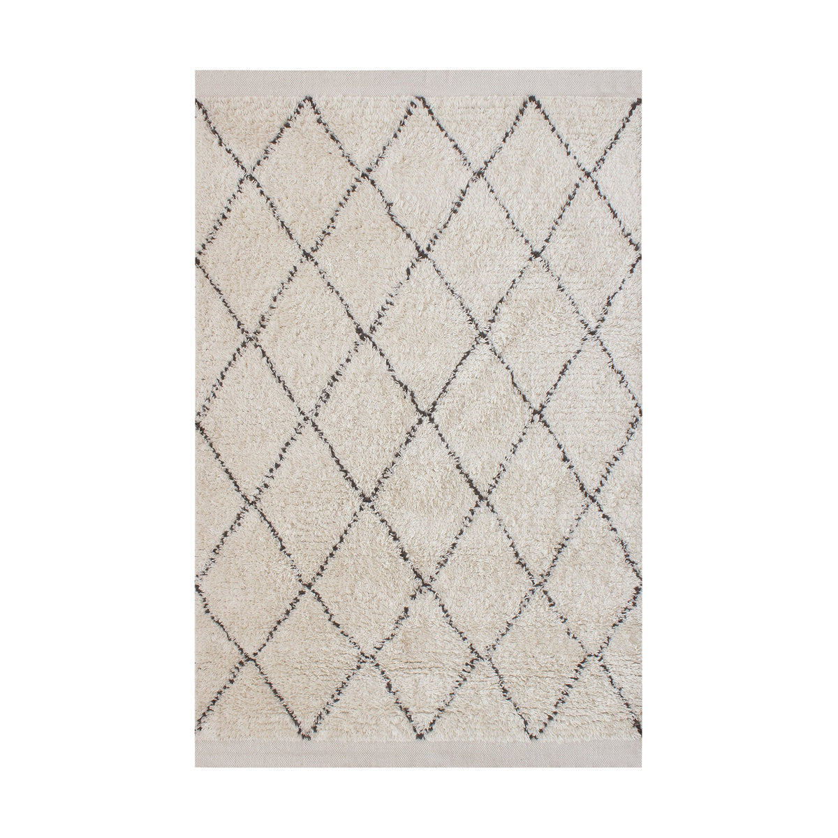 Syahi handwoven wool rug with a charcoal diamond lattice on ivory, in a study