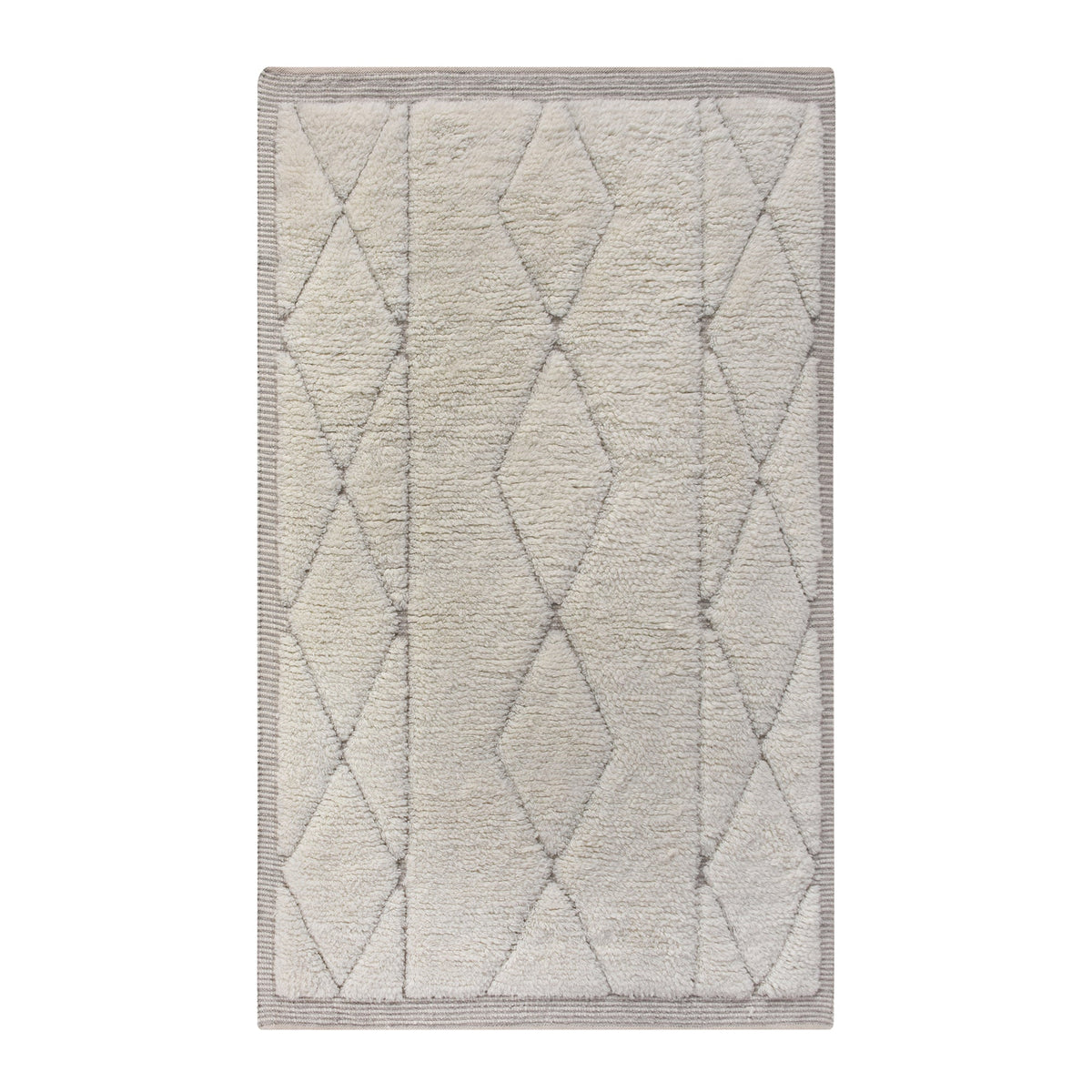 Ola handwoven New Zealand wool rug with an ivory Moroccan diamond lattice and grey, in a living room