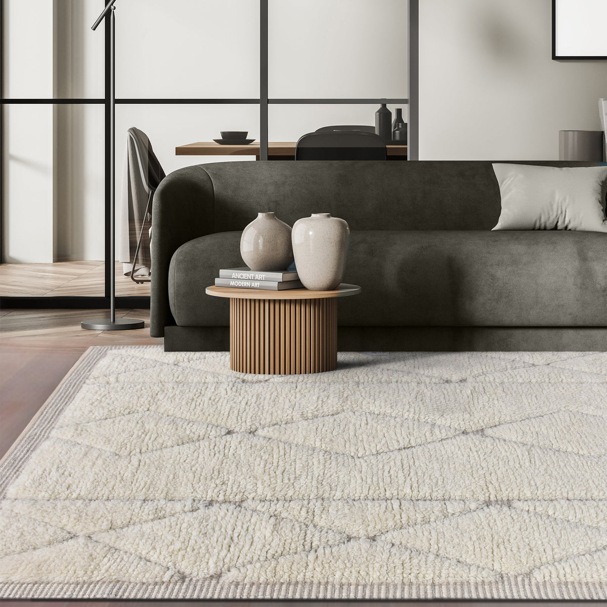 Ola handwoven New Zealand wool rug with an ivory Moroccan diamond lattice and grey, in a living room