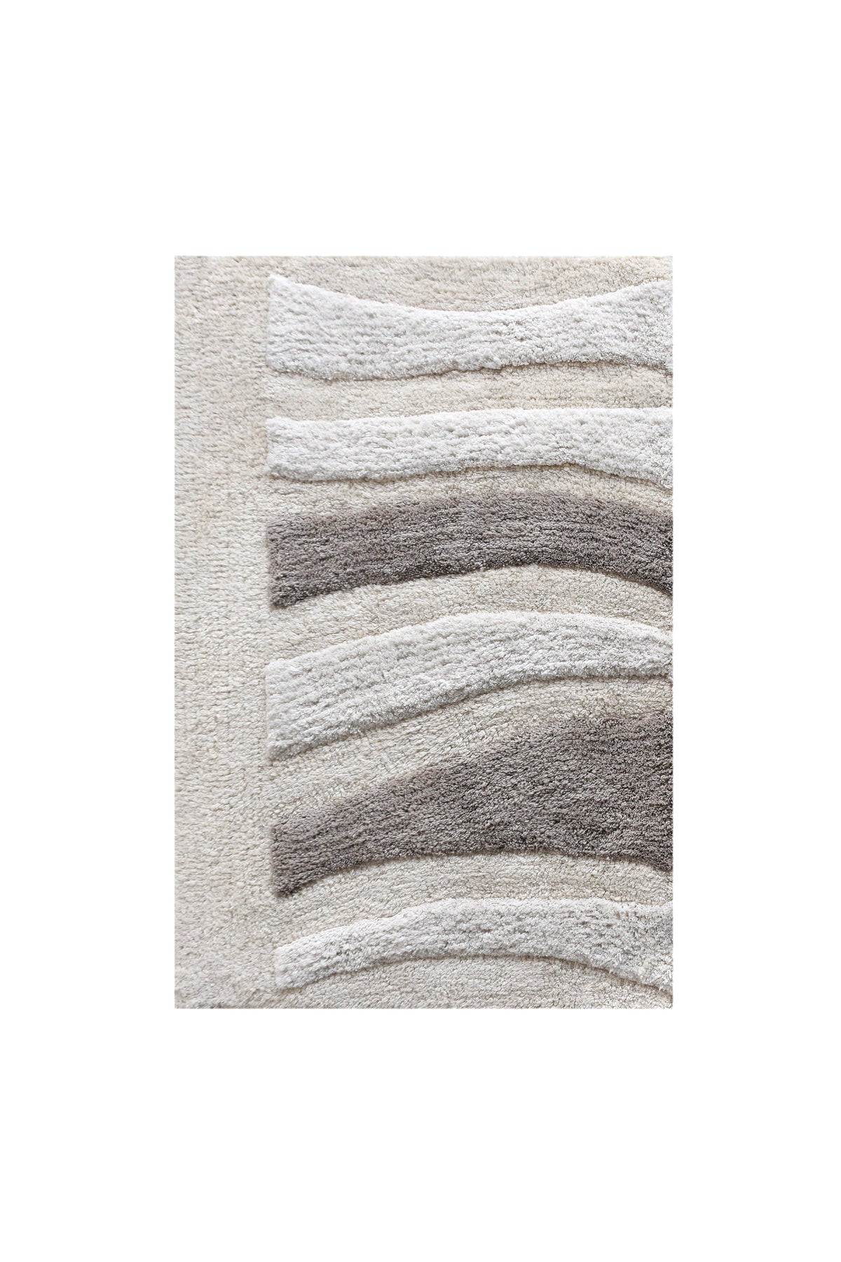 Silver Rill Cotton Bath Rug — Raised ivory and grey waves give this neutral bath rug movement and texture.