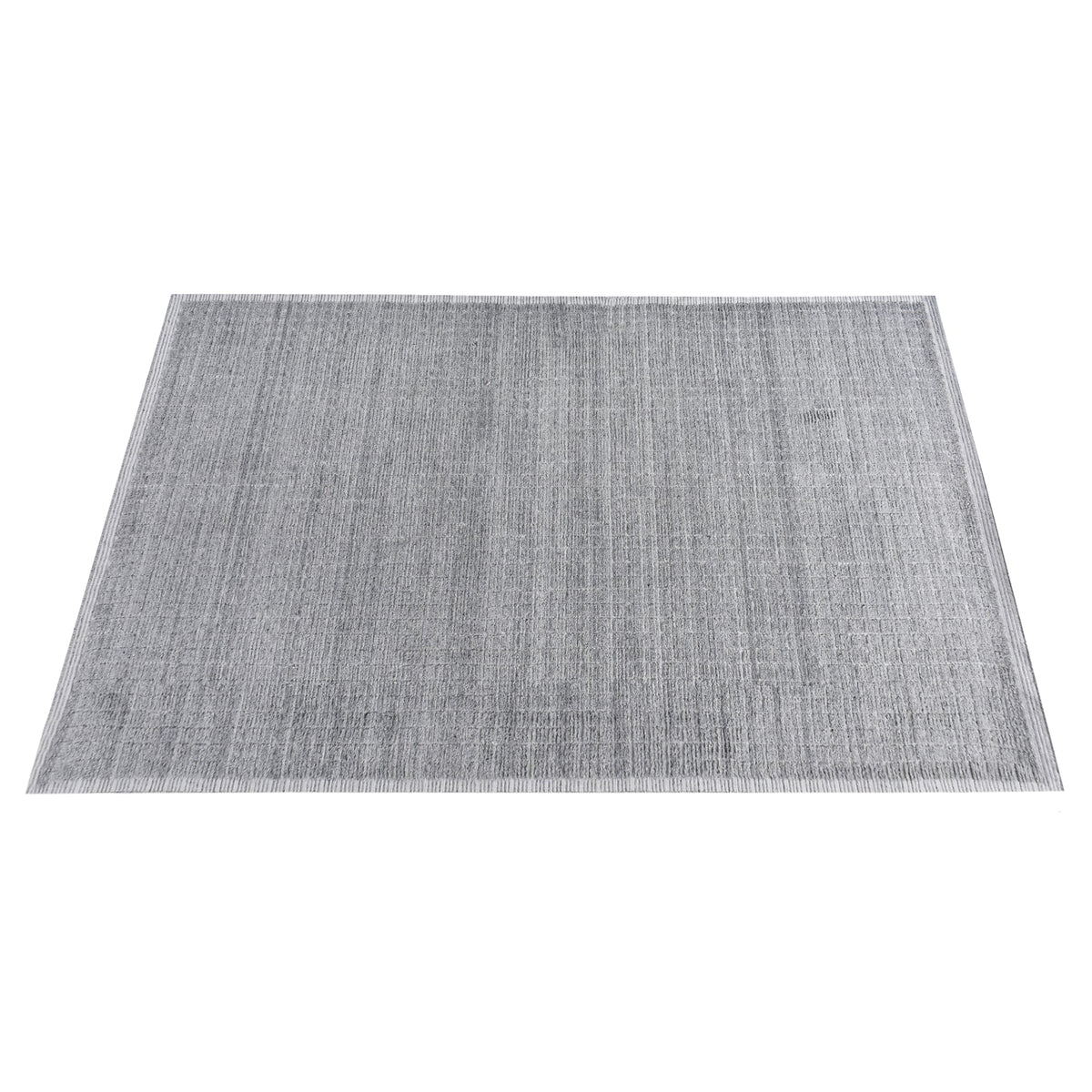 Raakh handwoven flatweave recycled PET rug in plain heather grey with fringe, in a living room