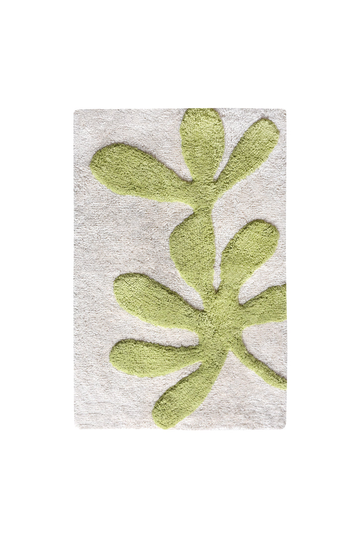 Olive Sprig Cotton Bath Rug — Green botanical shapes sit against an ivory ground.