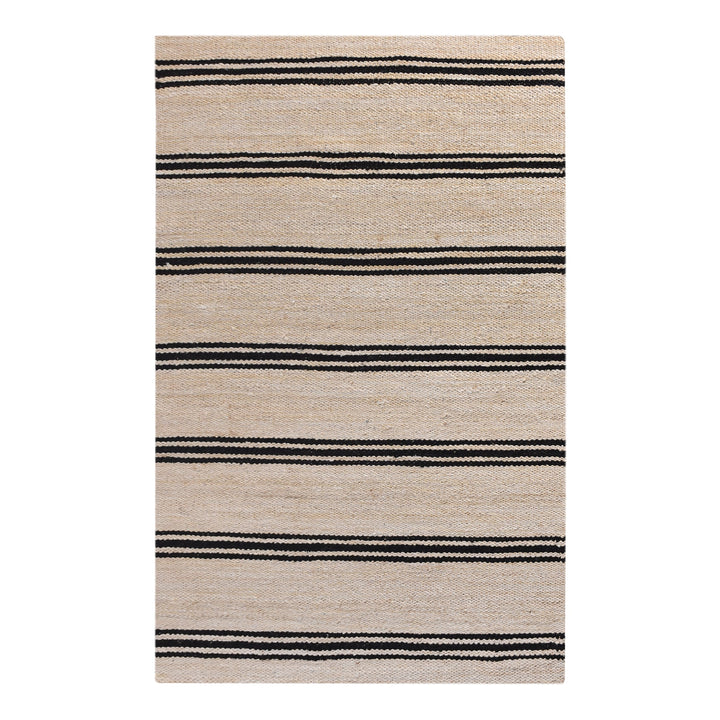Khaat handwoven natural jute rug with black stripes, in a living room