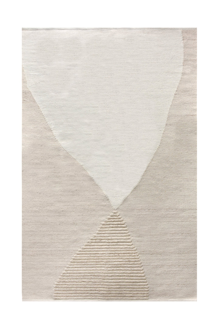 Kamaan handwoven wool flatweave rug with overlapping ivory and beige arcs, in a living room