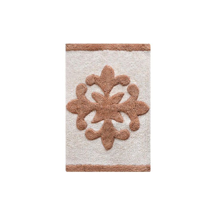 Sienna Bloom Cotton Bath Rug — A raised beige floral motif sits on an ivory ground.