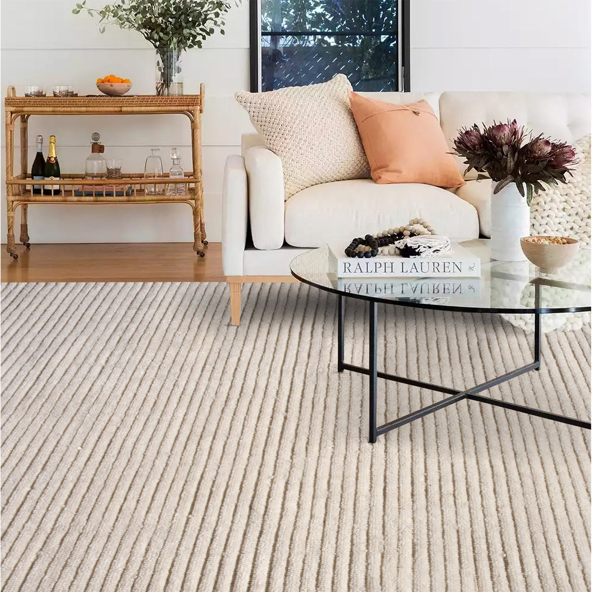 Hal handwoven NZ wool rug in ivory with wide ribbed stripes, in a dining room